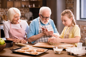 family kneading dough