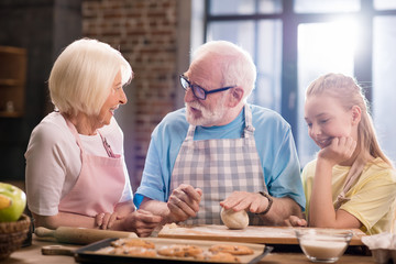 family kneading dough