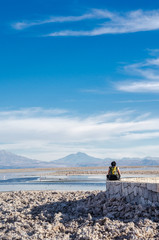 Naklejka na ściany i meble Lonely man enjoying at Chaxa Lagoon in Atacama Desert, Chile.
