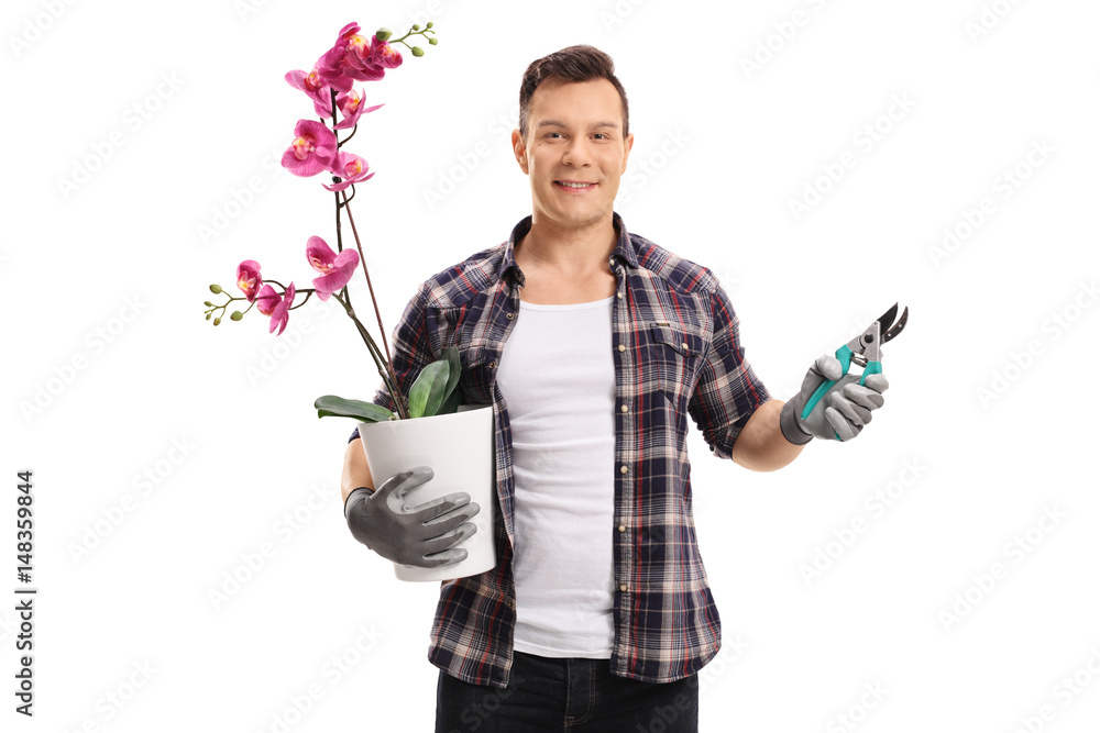 Wall mural Gardener with an orchid plant and garden shears