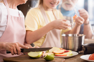 Family baking apple pie