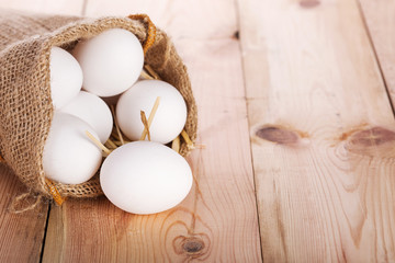 Fresh eggs on wooden table