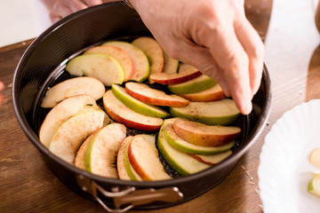 Person cooking apple pie