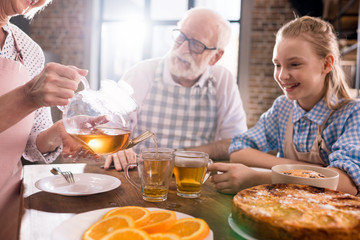 family drinking tea at home