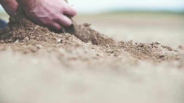 Farmer checking soil HD