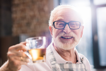 senior man with cut of tea