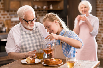 family drinking tea at home