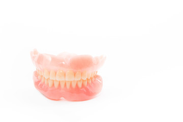 complte denture on white background