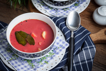 Vegetarian red soup - borsch in green bowl.
