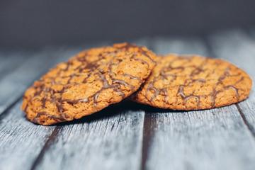 cookies in chocolate glaze on a wooden background