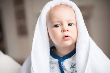 baby boy with white towel