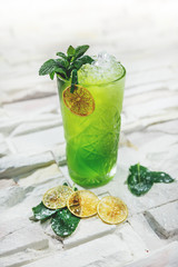 garnished cocktail on white background