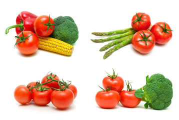 Ripe tomatoes and other vegetables on a white background