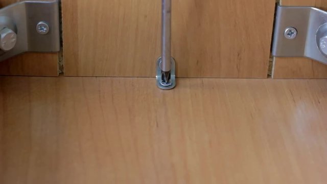 Furniture assembly with screwdriver