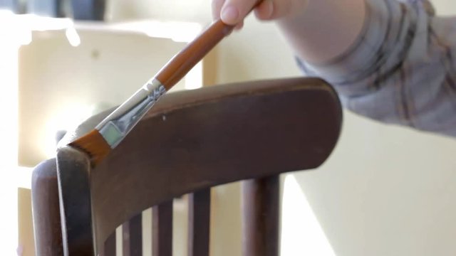 Furniture restoration with brush and lacquer