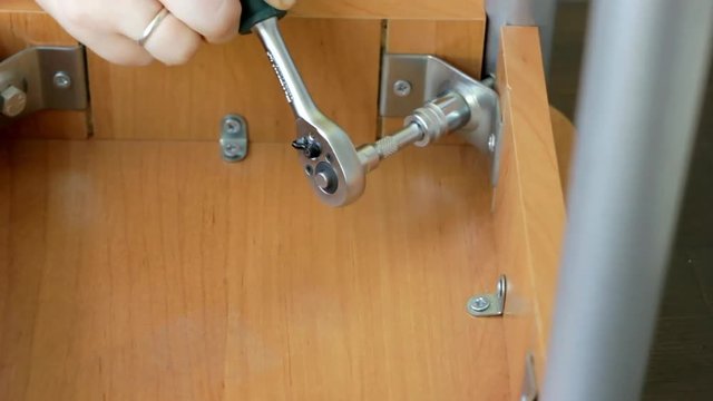 Furniture assembly with socket wrench