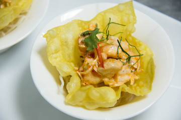 spicy seafood salad in white cup