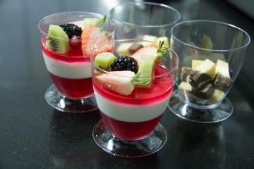  fruit jelly ontop wild strawberries, blackberries kiwi  slice