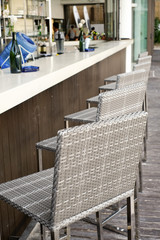 Beautiful elegant interior design, bar counter top with ratan chairs