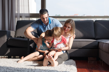 happy young couple spending time with kids