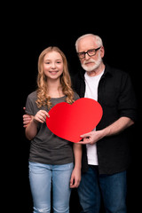 Grandfather and granddaughter with heart symbol