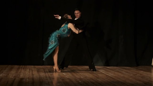 Couple, young beautiful woman and young man dance  