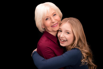 grandchild and grandmother hugging