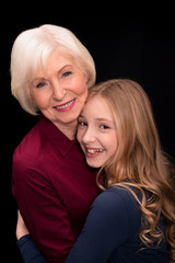 grandchild and grandmother hugging