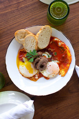 Eggs over medium with sausage and fresh baked bread