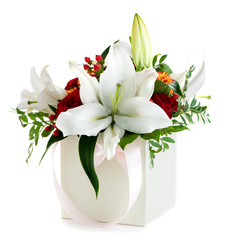Gift box with fresh lily flowers and chrysanthemum isolated on white background