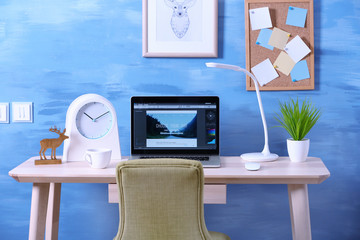 Workplace with computer on table in modern room