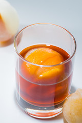 Alcohol cocktail with mandarin ice bal