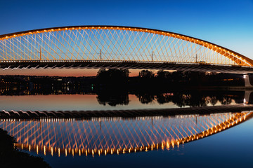 Fototapeta premium Troja bridge Prague over the Vltava river in the night with illumination. Trojsky most . Czech Republic