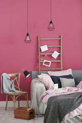 Interior of modern bedroom with cozy double bed