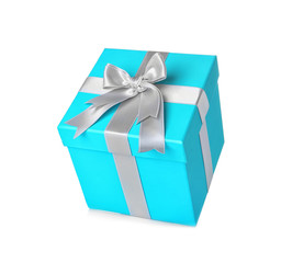 Beautiful turquoise gift box with silver ribbon on white background