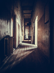 Fototapeta na wymiar The gloomy corridor in the old house