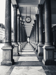 Symmetrical collonade with a clock