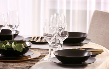 Table with beautiful setting in restaurant, closeup