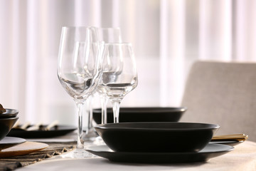 Table with beautiful setting in restaurant, closeup