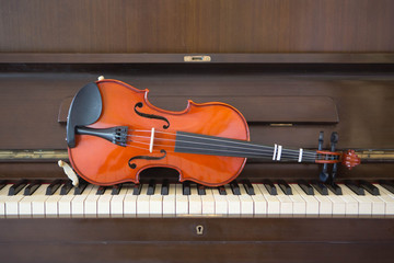 Violin on piano keys, closeup