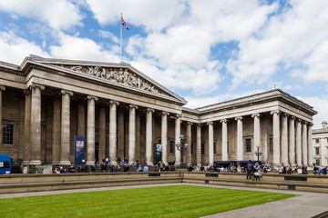 Trafalgar Square full of people walking along with the tourists taking photos