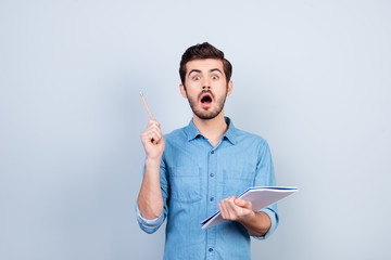 Eureka! Young smart man invented brand new idea for business. He is shocked