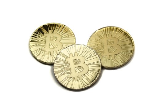Three shiny bitcoin coins on white background