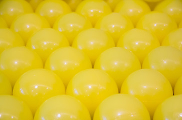 yellow plastic balls background