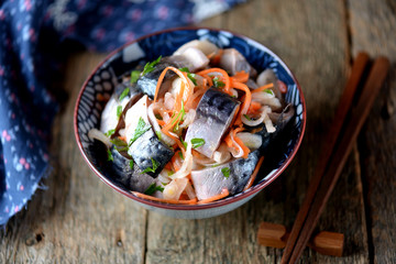 Marinated mackerel with onion and carrots in vinegar and olive oil. Korean food.