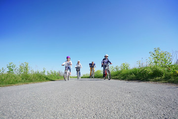 Obraz premium Family of four on a biking day