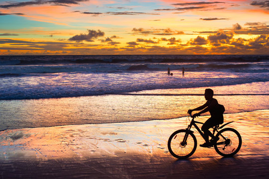 Cycling on the beach, silhouette