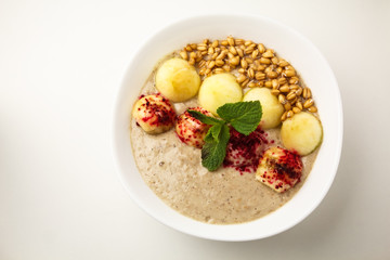 Porridge with apples and sprouted wheat. Theme of raw food, live food, healthy eating background