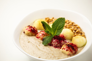 Porridge with apples and sprouted wheat. Theme of raw food, live food, healthy eating background