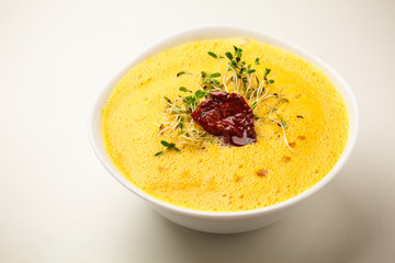Vegan creamy soup with tomato sun-dried tomato. Theme of raw food, live food, healthy eating background